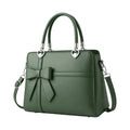 Modern Wrenfield Emerald Green Shoulder Bag, front view with sculpted bow accent