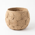 Handwoven jute rope spiral planter basket, front view on a white background