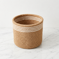 Boho jute planter basket with white stripes, front view on a white background